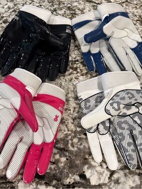 Four Pairs of Football Grip Boost Gloves in Black, Navy, Pink, and white